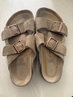 Birkenstock women’s Suede Two-Strap Sandals in Taupe Brown with Rose Buckles